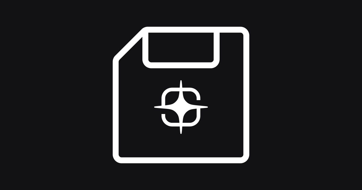 A white outline icon of a floppy disk on a dark gray background. The floppy disk has a rectangular shape with a cut corner at the top left, a small rectangular label area at the top, and a circular element in the center with a crosshair or targeting symbol inside it.